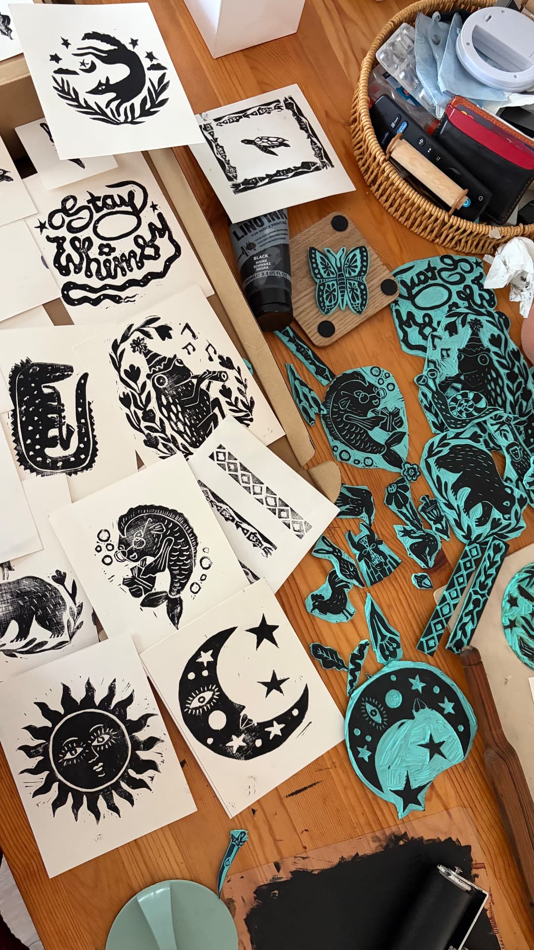 Black prints and turquoise carved printing blocks